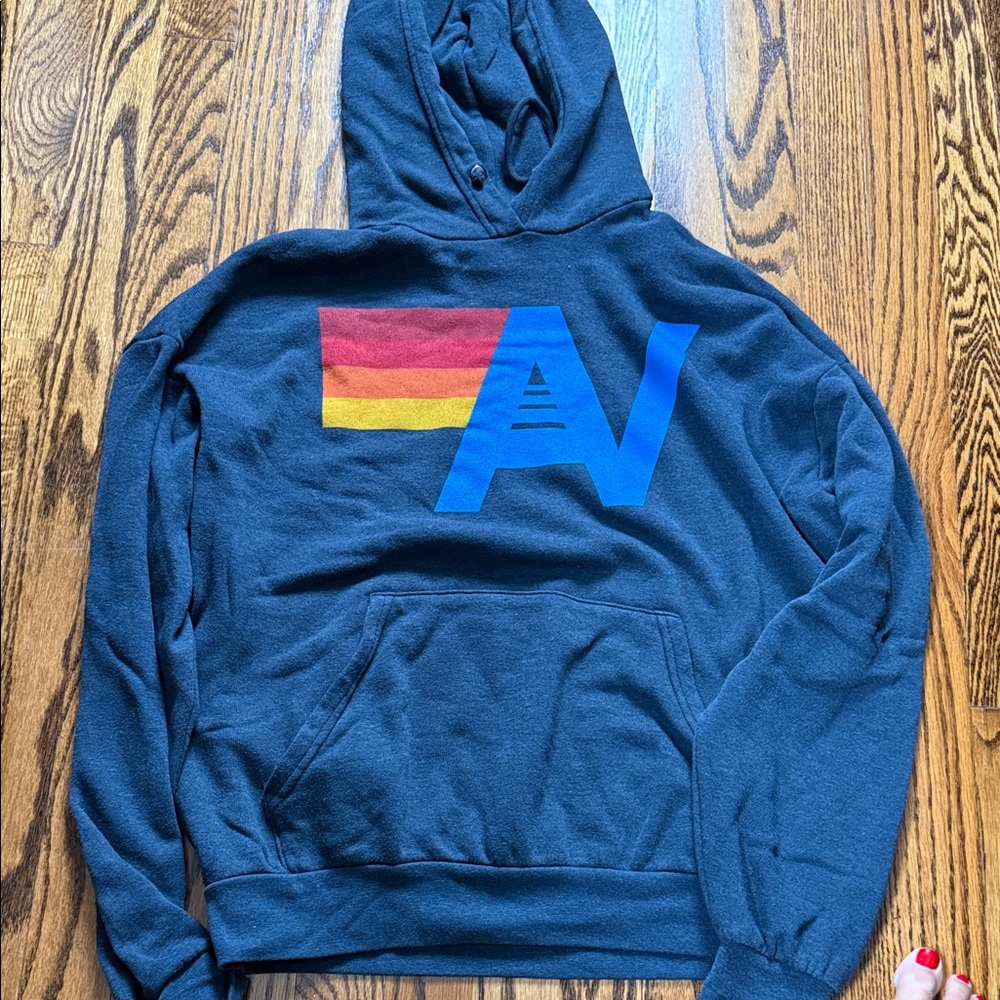 NWOT Aviator Nation Blue Hoodie with Red and Yellow Graphic.  Xs